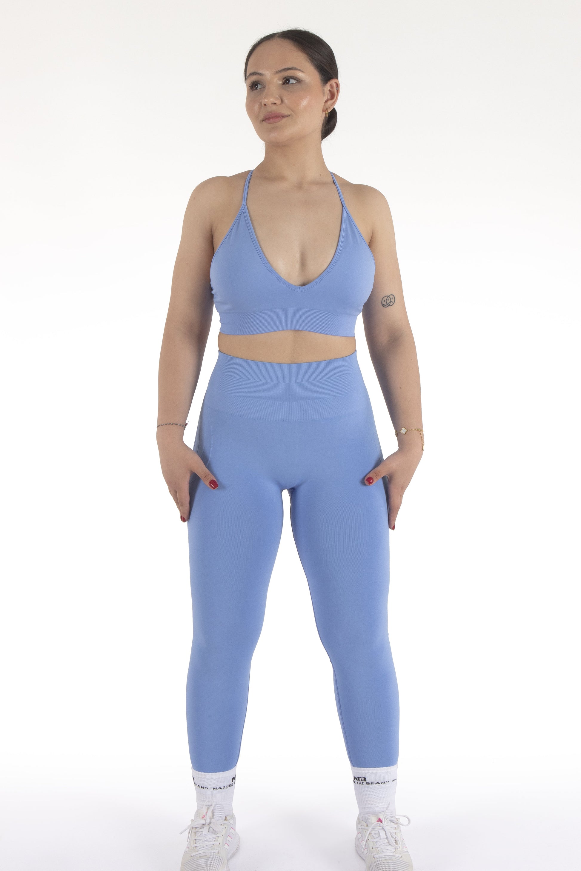 Hoch taillierte, nahtlose und geraffte Push-Up Sportleggings in Blau